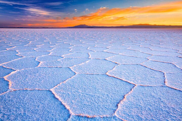 A salt flat in Salar de Uyuni, Bolivia at sunset.