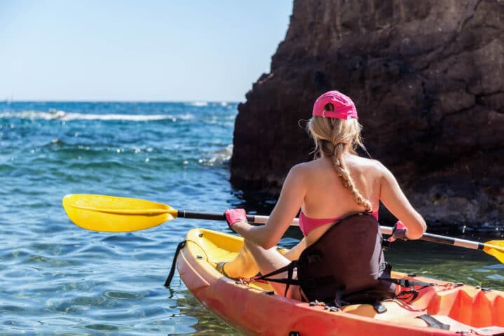 A woman kayaking.