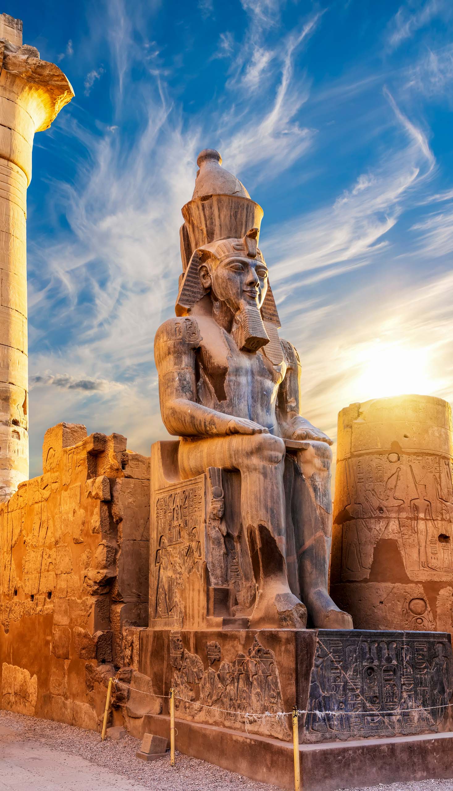 Seated statue of Ramesses II by the Luxor Temple entrance, Egypt.