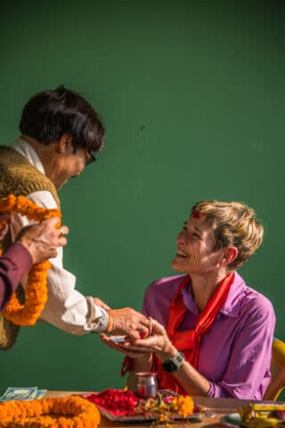 A woman enjoying Nepal cuisine.