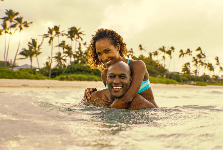 A couple swimming in the ocean.