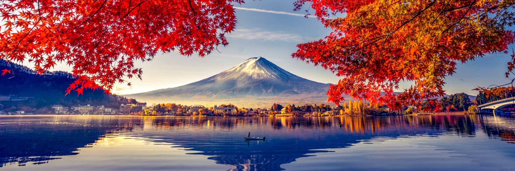 Mountain Fuji with morning fog and foliage at lake Kawaguchiko.