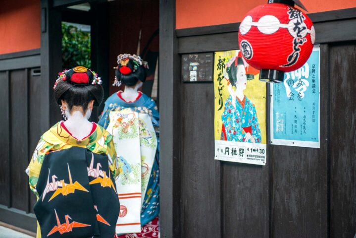 Two women dressed in kimonos.