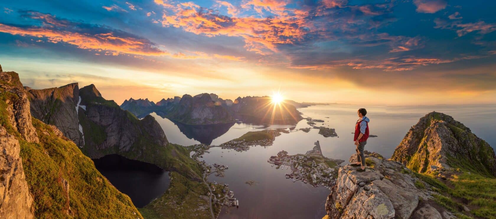 A traveler enjoys a summer view of Lofoten Islands in Norway.