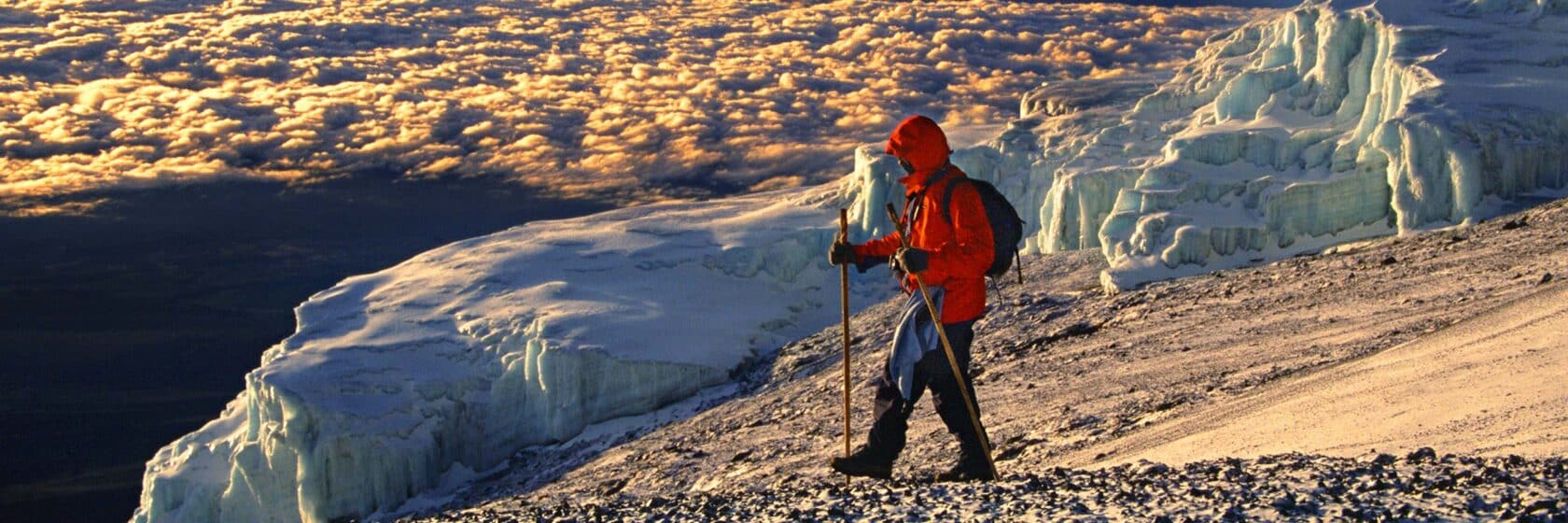 A person hiking at sunrise.