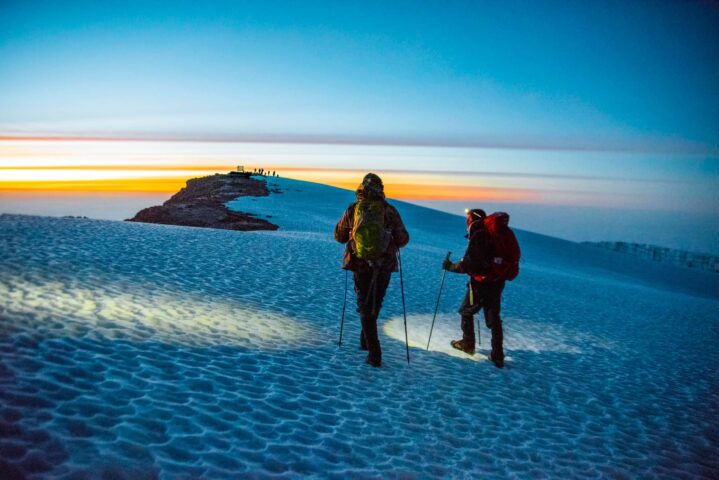 Two people hiking Barafu.