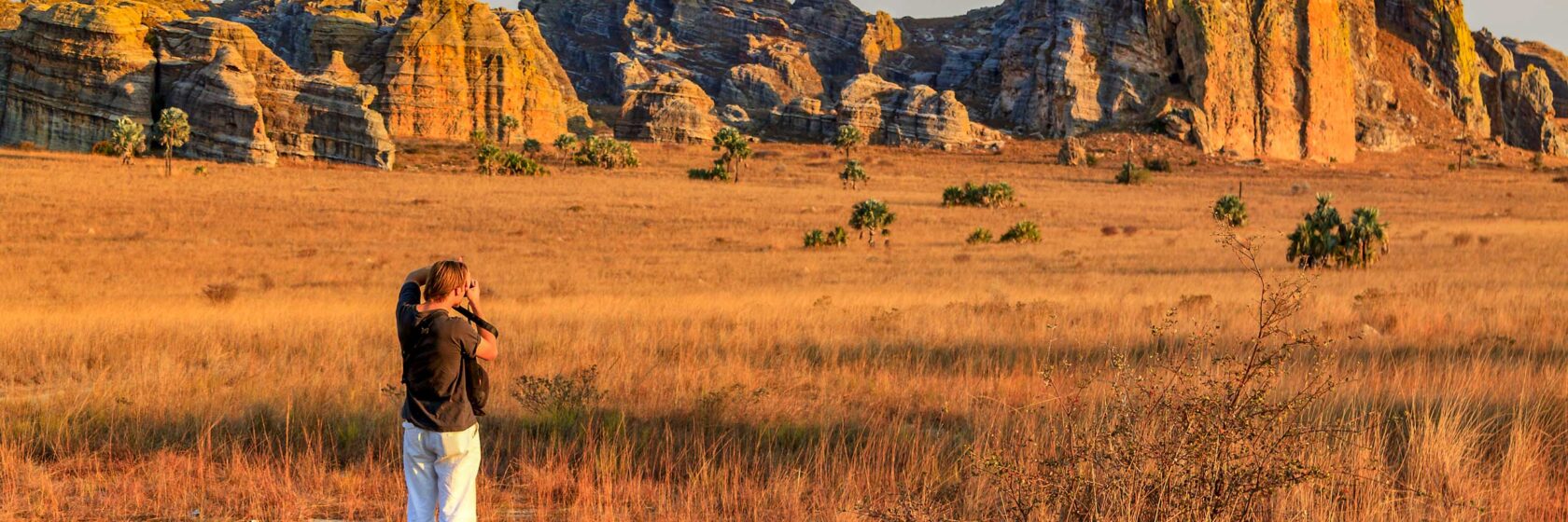 A tourist photographing a landscape in Madagascar.