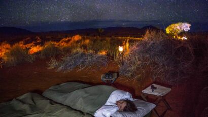 A traveler sleeping at a campsite on Tok Tokkie trail in Namibia.