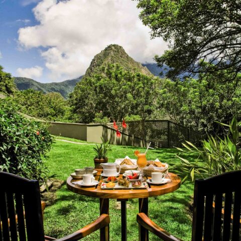 A meal for two set up outdoors.