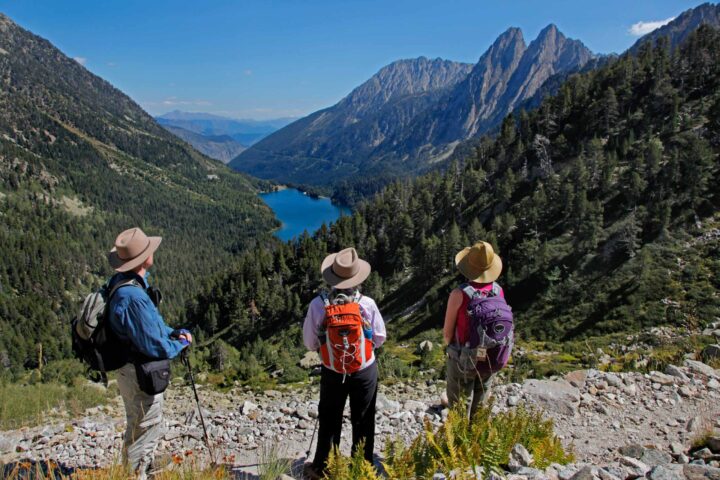 Three hikers in a valley in Spain.