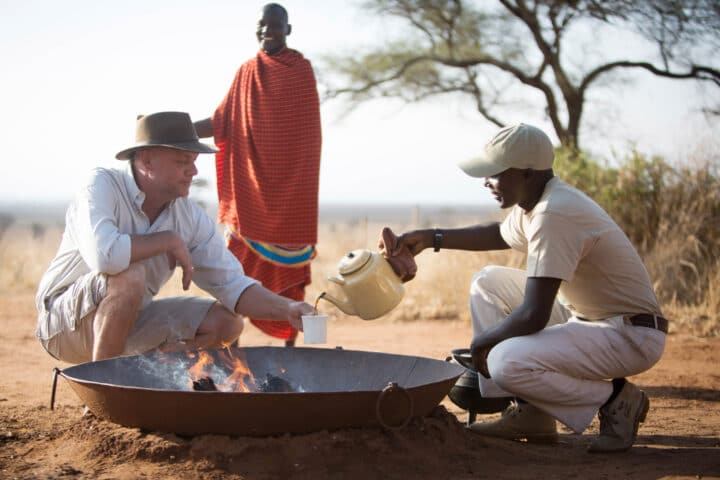 A traveler being served coffee.